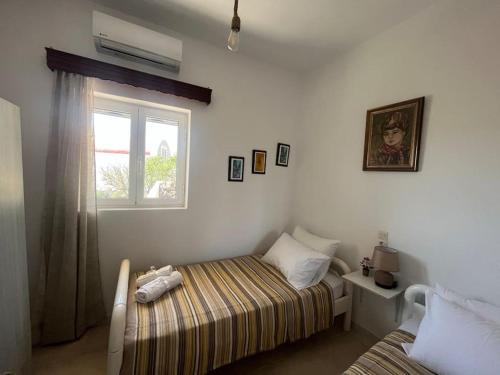 Postel nebo postele na pokoji v ubytování Koudoumalos House - The heart of Crete!