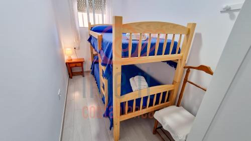 Katil atau katil-katil dalam bilik di APARTAMENTO FOSSA. PRIMERA LINEA DE PLAYA. CALPE. LIVE IT COSTABLANCA