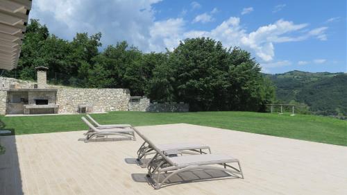 a group of chairs sitting on a patio at OASI DA VINCI in Tignale