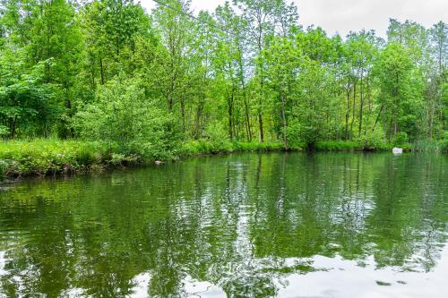 a body of water with trees in the background at Cascina Veja in Chiusa di Pesio