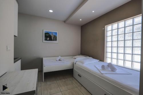 Postel nebo postele na pokoji v ubytování Hotel Alpha