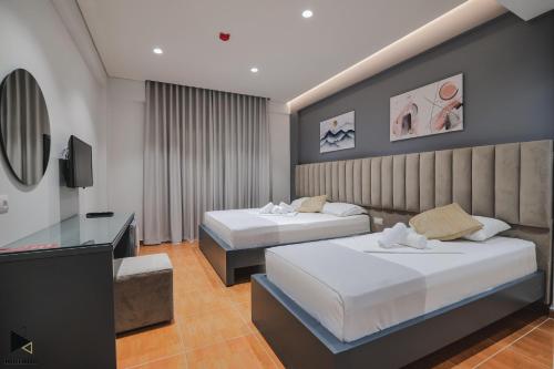 Postel nebo postele na pokoji v ubytování Hotel Alpha