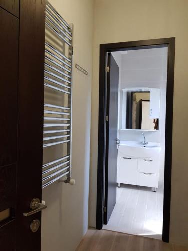 a bathroom with a sink and a mirror at Villa in Tbilisi in Tbilisi City