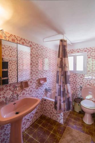 a bathroom with a sink and a toilet at Villa Panos in Gaios