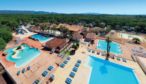 an overhead view of a resort with two pools at 6/8 pax COTTAGE - Oasis Village in Puget-sur Argens