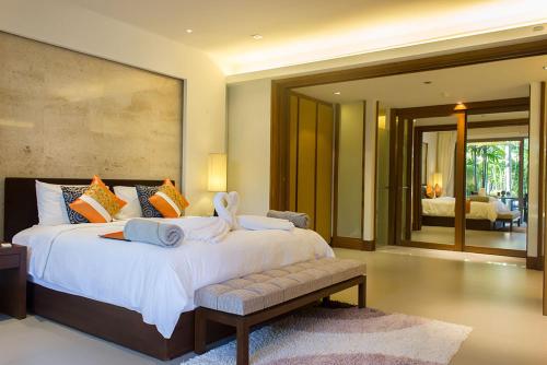 Ένα ή περισσότερα κρεβάτια σε δωμάτιο στο Nai Thon Beachfront Apartments