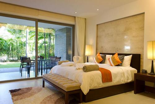 Ένα ή περισσότερα κρεβάτια σε δωμάτιο στο Nai Thon Beachfront Apartments