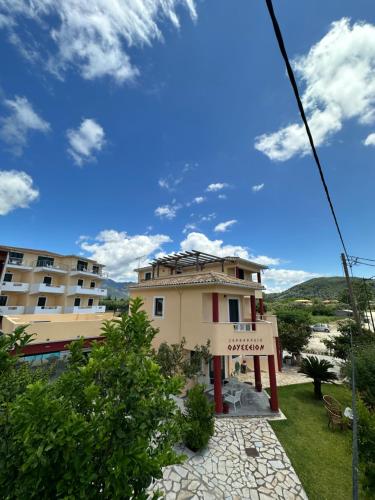 a view of a building with a blue sky at Hotel Odyssion in Vasiliki