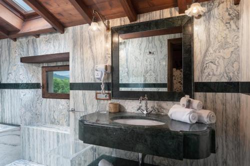 a bathroom with a sink and a mirror at Villa Torre Delle Rose - Firenzuola, Private Pool, Ac, Privacy in Castelvecchio
