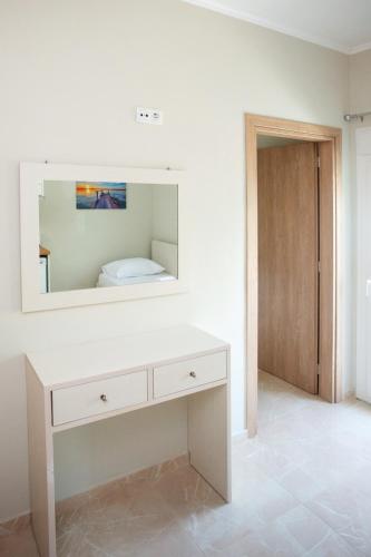 Ένα ή περισσότερα κρεβάτια σε δωμάτιο στο Joanna's Apartments
