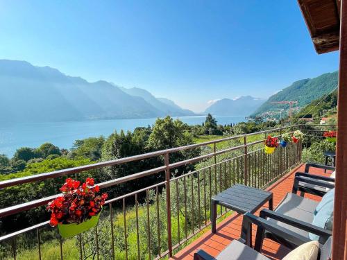 a balcony with a view of the water and mountains at Appartamento Tivano, balcone con vista lago in Bellagio