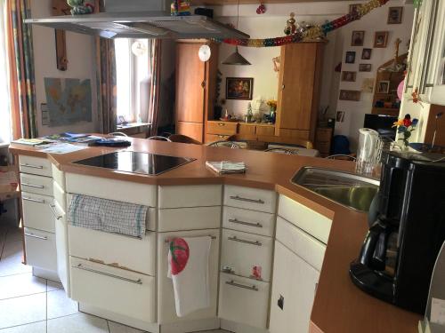 a kitchen with a sink and a counter top at Doppelzimmer mit Wasserbett in Winningen