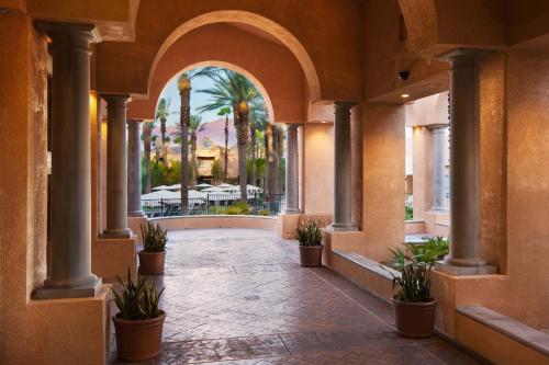 a hallway of a building with potted plants at The Westin Mission Hills Resort Villas, Palm Springs in Rancho Mirage