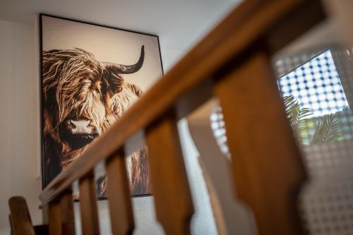 a picture of a bull on the wall at Engel 16 in Gutach