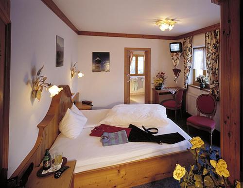 Postel nebo postele na pokoji v ubytování Hotel Aurach