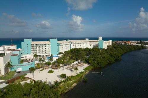 an aerial view of a resort next to a body of water at The Westin Resort & Spa Cancun in Cancún