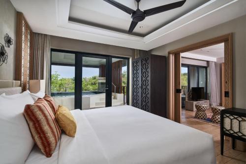 Tempat tidur dalam kamar di Marriott's Bali Nusa Dua Terrace