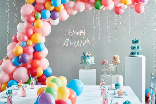 a birthday party with balloons and a table with a cake at Delta Hotels by Marriott Tudor Park Country Club in Maidstone