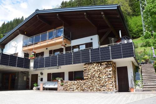 a house with a balcony on top of it at Appartement Bühelblick in Gaschurn