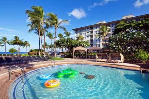 a swimming pool with two inflatable boats in it at The Westin Ka'anapali Ocean Resort Villas in Lahaina