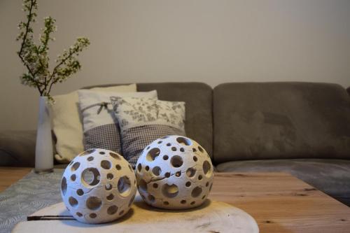 two polka dot balls sitting on a table in front of a couch at Appartement Bühelblick in Gaschurn