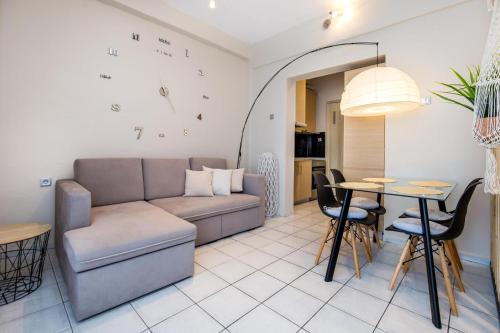 a living room with a couch and a table at Casa di Zou in Skala Marion
