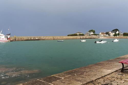 a group of boats in a body of water at Gîte Casa' Nahi. Barfleur in Barfleur