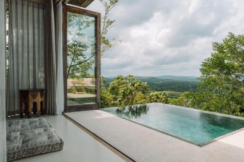 a pool in a house with a view at Malabar Hill in Weligama