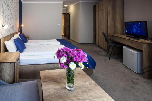 Katil atau katil-katil dalam bilik di Family Hotel Familia