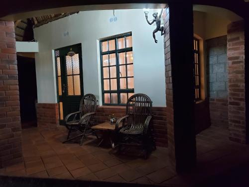 Posezení v ubytování Edaala Comfort - Cottage Rooms