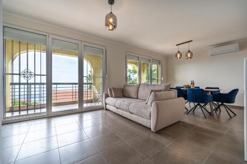 a living room with a couch and a table at Villas Monte Hill in Budva