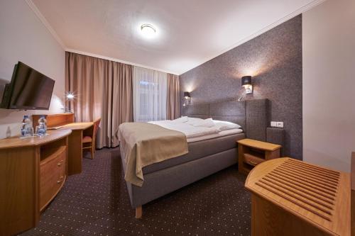 Cama o camas de una habitación en Hotel Adam Trutnov
