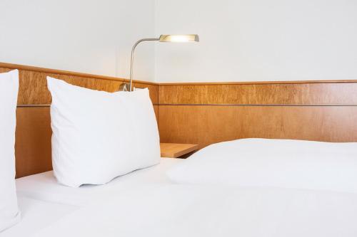 Postel nebo postele na pokoji v ubytování Hotel Rad