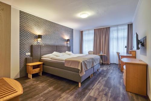 Cama o camas de una habitación en Hotel Adam Trutnov