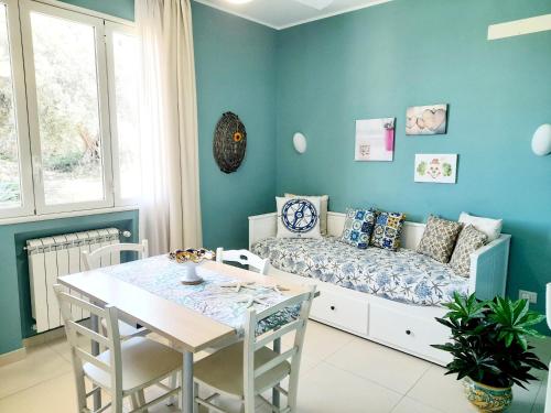 a living room with a couch and a table at Appartamento Castel Sant'Angelo in Licata