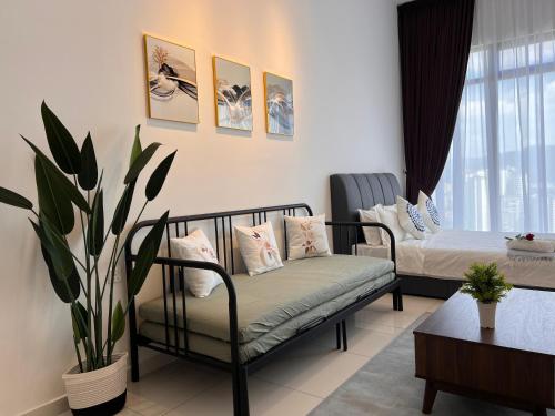 a living room with two beds and a couch at Georgetown#Amazing SkyPool#Modern & Elegant Suite# in George Town