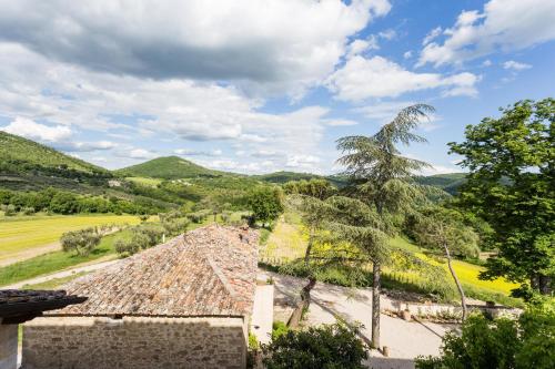a view of the hills from the roof of a house at Borgo Colognola - Dimora Storica in Cenerente