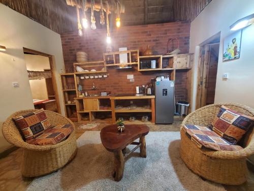 Posezení v ubytování Edaala Comfort - Cottage Rooms