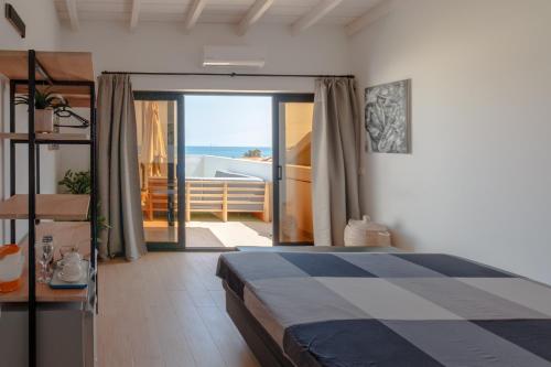 a bedroom with a bed and a view of the ocean at New Rooftop Penthouse with Oceanview in Santa Maria