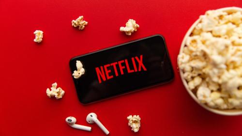 a cell phone with the netflix sign next to a bowl of popcorn at Suite Poseidon Golf & Ocean View in San Miguel de Abona