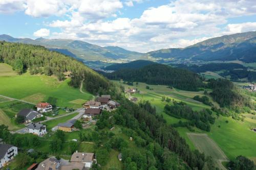 an aerial view of a small village in the mountains at Holzerhof Lothen , Campolino in San Lorenzo di Sebato