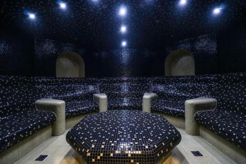 a room with a stage with a table and chairs at Design Studio in Atlantis Resort&SPA, Burgas Airport in Burgas City