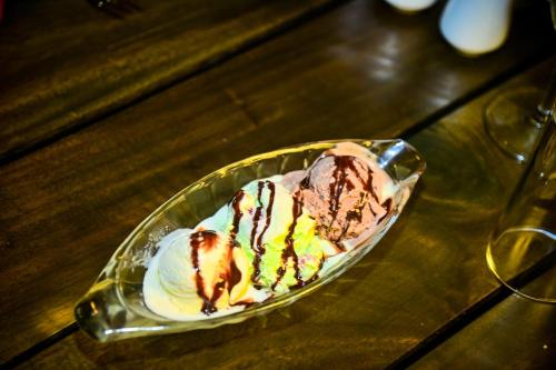 a plate of ice cream on a table at New Sea Villa in Negombo