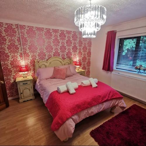 a bedroom with a bed with two towels on it at Bryn Mynach in Barmouth