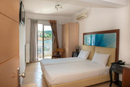 Postel nebo postele na pokoji v ubytování Hotel Lido Thassos