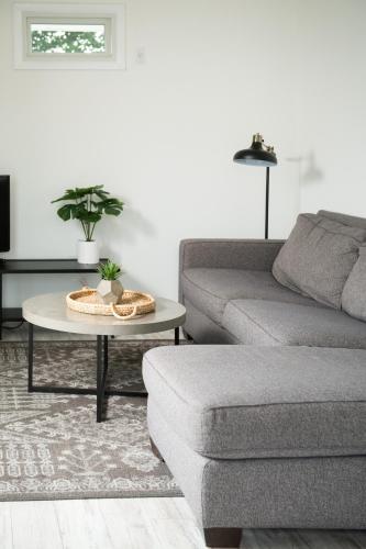 a living room with a couch and a table at The Carriage House at Strasburg in Strasburg