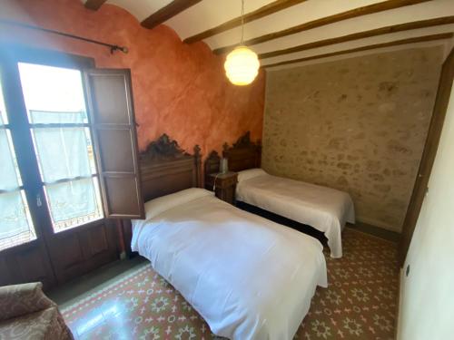 Postel nebo postele na pokoji v ubytování Casa Morató