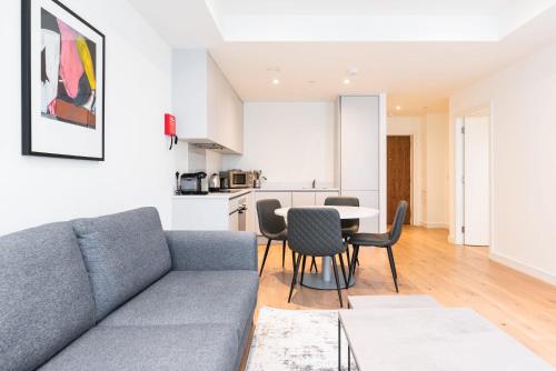 a living room with a couch and a table at The Hunt One in Dublin