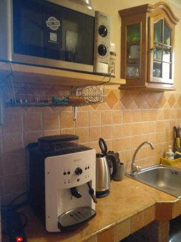 Η κουζίνα ή μικρή κουζίνα στο Gréti Apartman