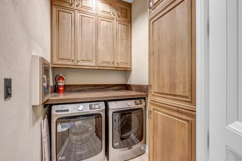 a small kitchen with a washer and dryer at The Villa on Matern New Listing in Horseshoe Bay